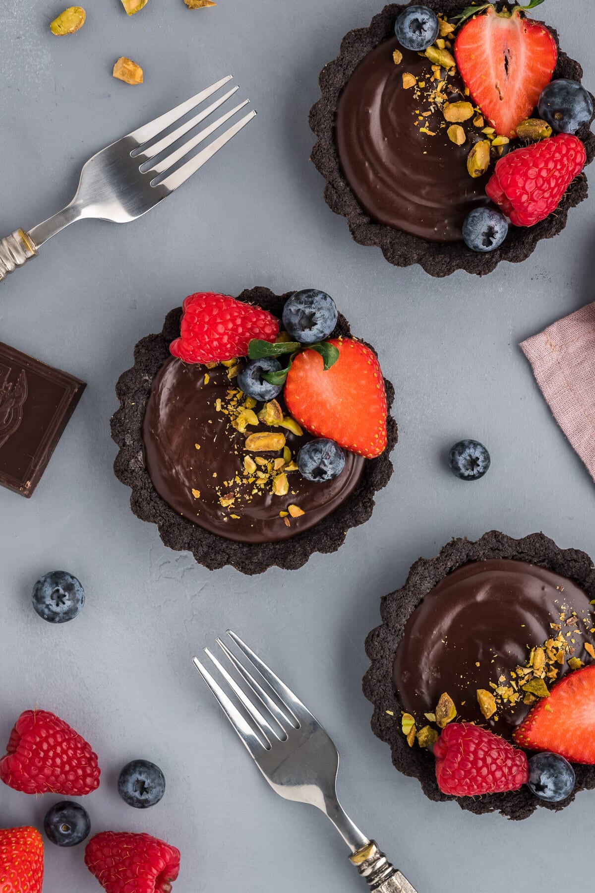 Mini Chocolate Tart Recipe with blueberries on top.