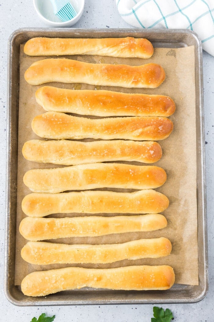 Copycat Olive Garden breadsticks on a baking sheet