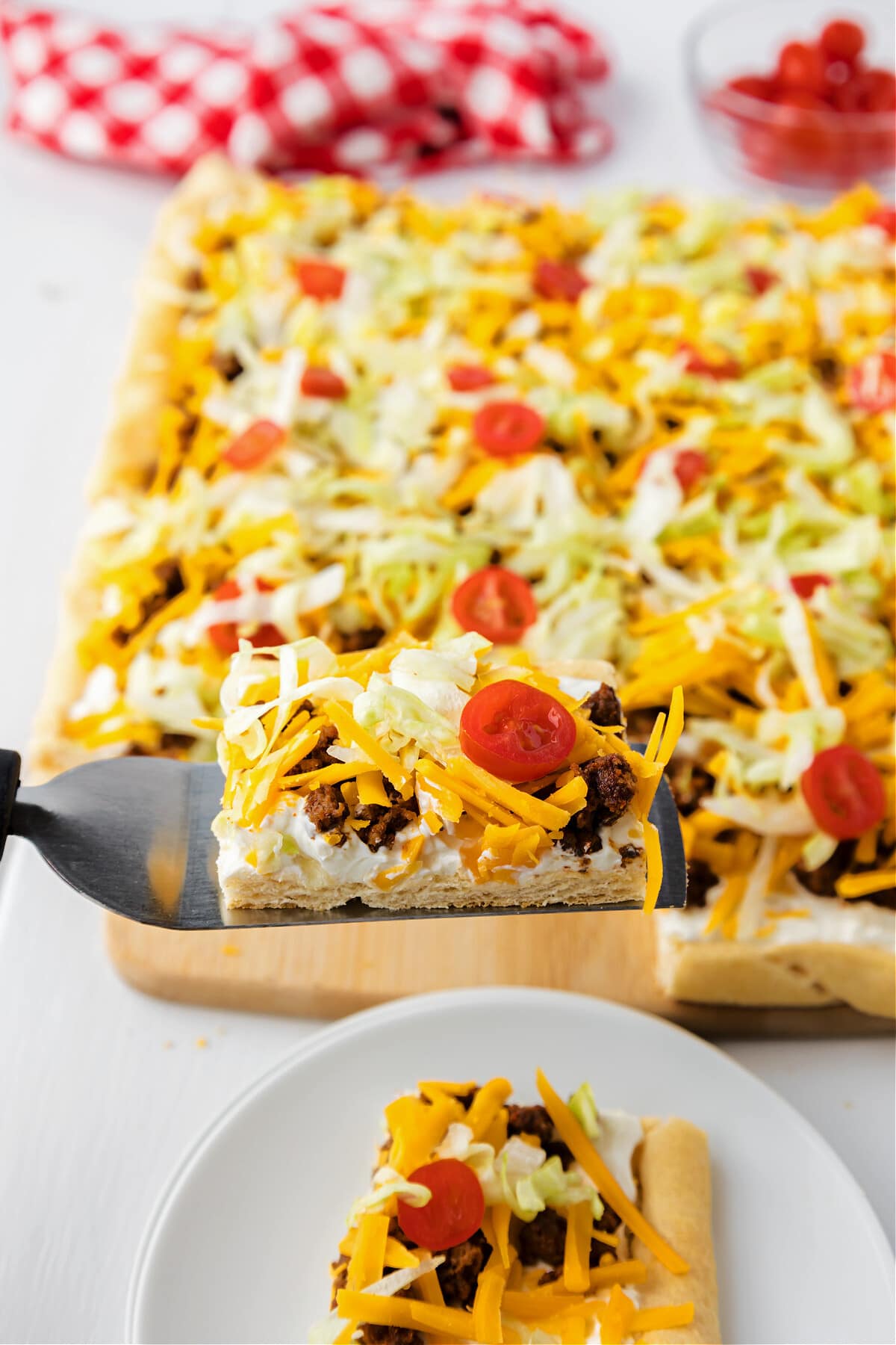 taco pizza cut and on serving spatula