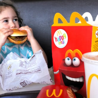 Girl eating burger from McDonalds