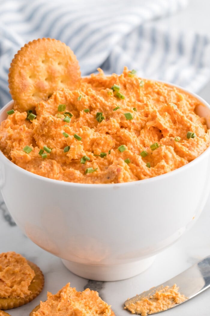 Pimento Cheese in a bowl with a Cracker