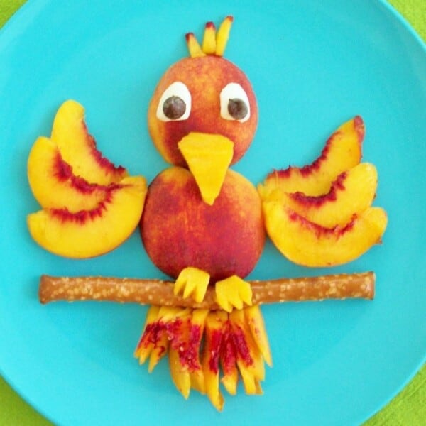Peach Parrot Fruit Snack on a blue plate