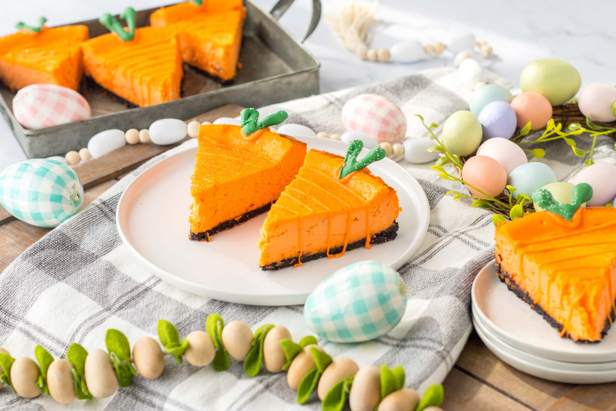 Carrot Cheesecake surrounded by easter eggs.
