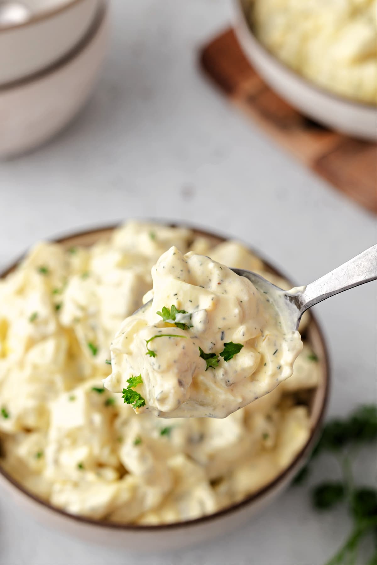 spoon with creamy potato salad
