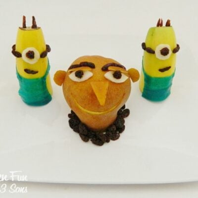 Despicable Me Fruit Snack made with a pear, bananas and raisins on a plate