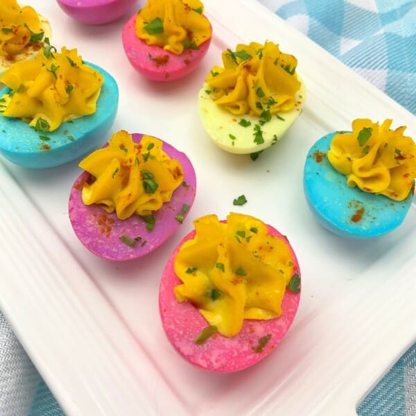 Easter Deviled Eggs on a rectangle tray.