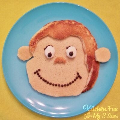 Curious George Pancakes on a blue plate