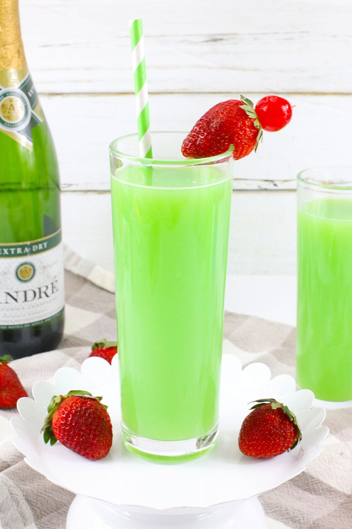 Green Mimosa topped with strawberries.