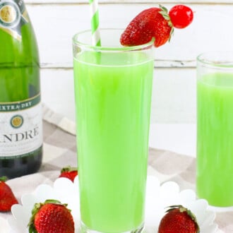 Green Mimosa topped with strawberries.