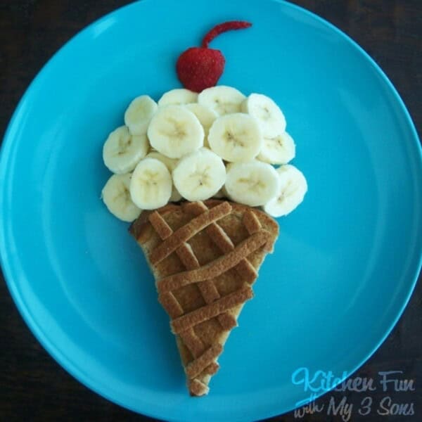 Ice Cream sandwich with bananas on a blue plate
