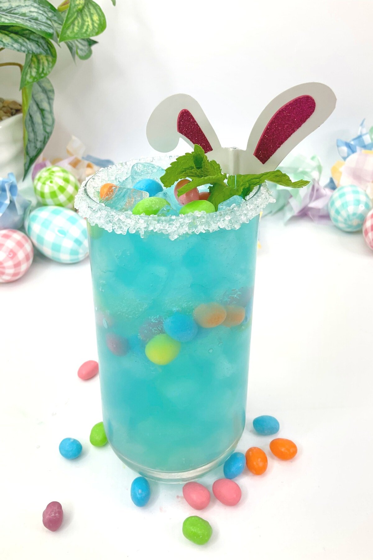 Jelly Bean Cocktail with candies all around it.