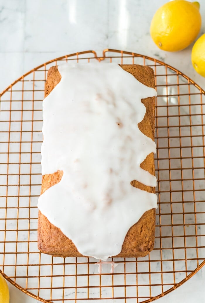 Adding the icing on top of the Lemon Loaf with Cream Cheese.