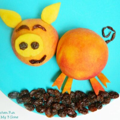 Peach Pig Fruit Snack with raisins on a blue plate