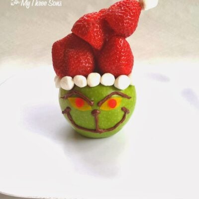 Grinch fruit snack made with apple and strawberries
