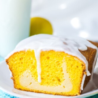 Lemon Loaf with Cream Cheese on a blue place mat.