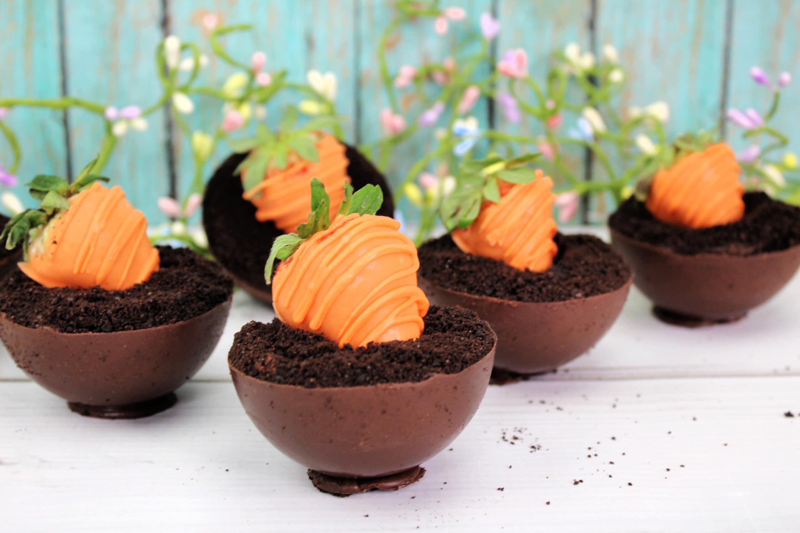 Carrot Patch Dirt Cups  with a spring background.
