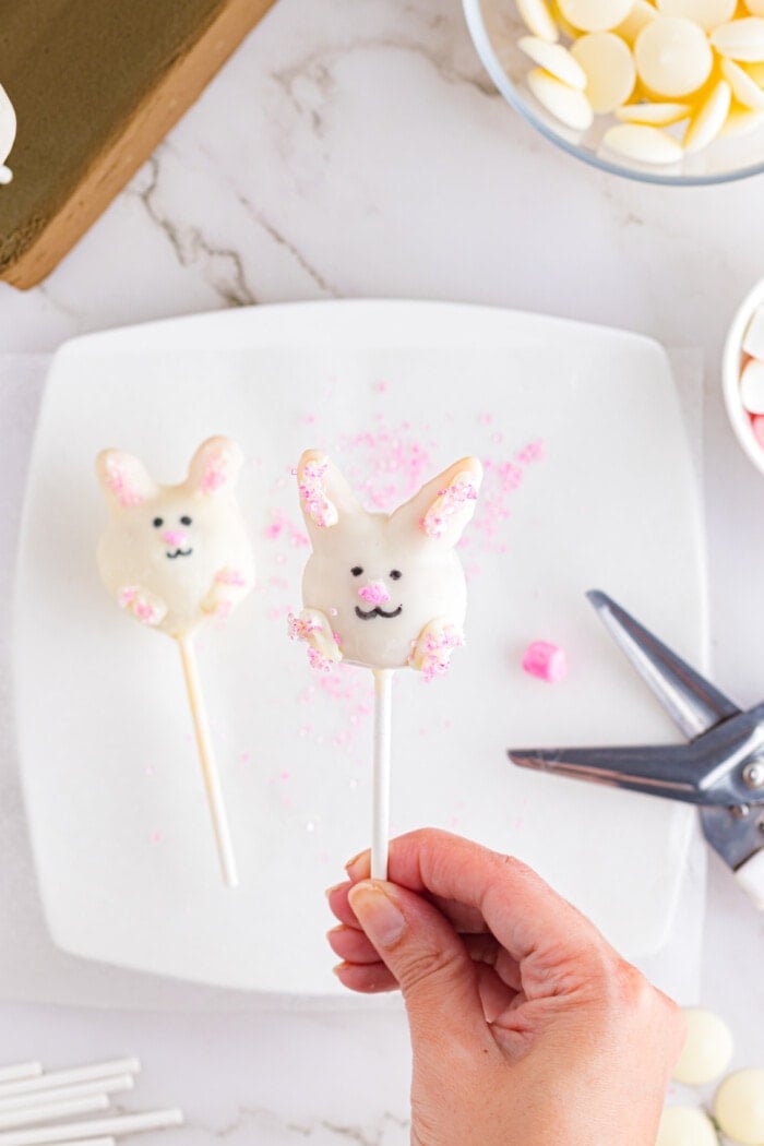 Adding the mouth onto the Easter Cake Pops.
