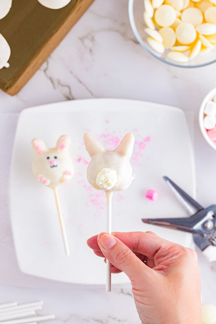 Adding the tail onto the Easter Cake Pops.