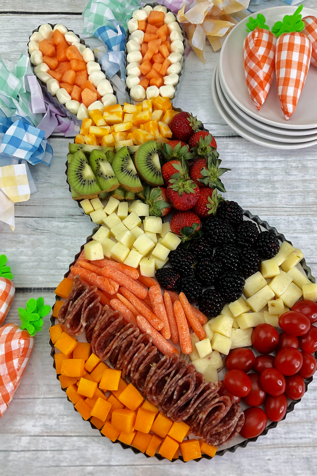 Easter Fruit Tray with plushie carrots on the side.