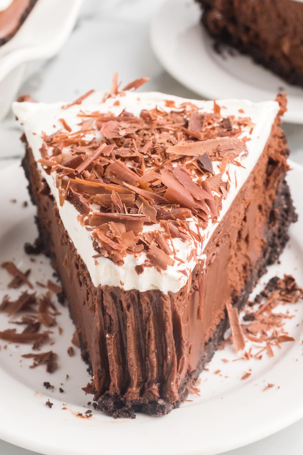 Front view of a slice of chocolate French silk pie