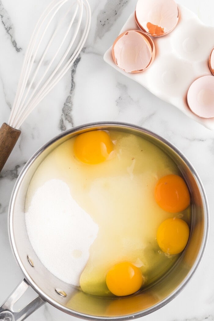Eggs and sugar in a saucepan