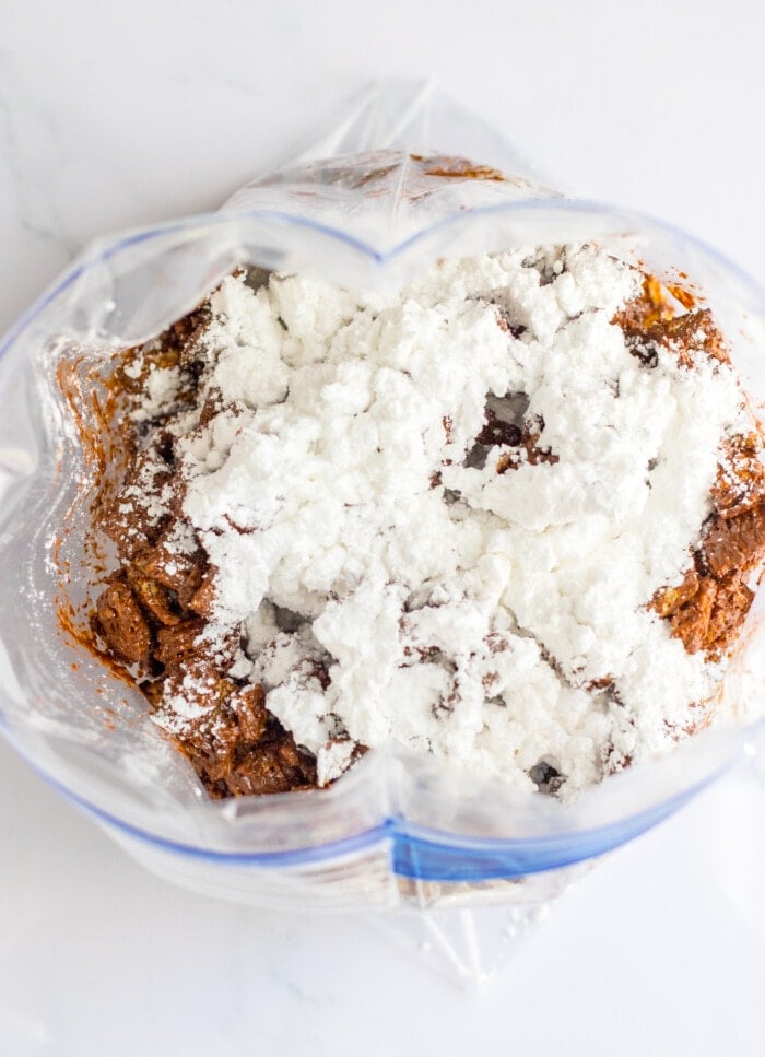 Adding the powdered sugar.
