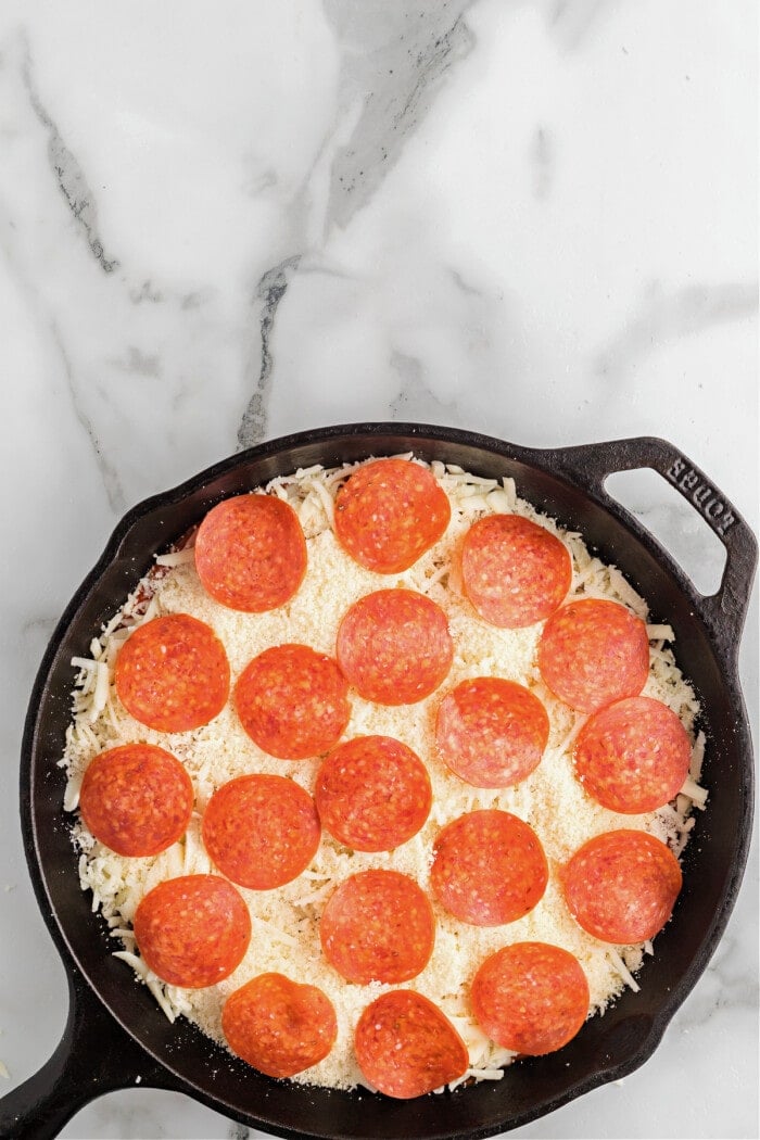 pepperoni in cast iron skillet for pizza dip