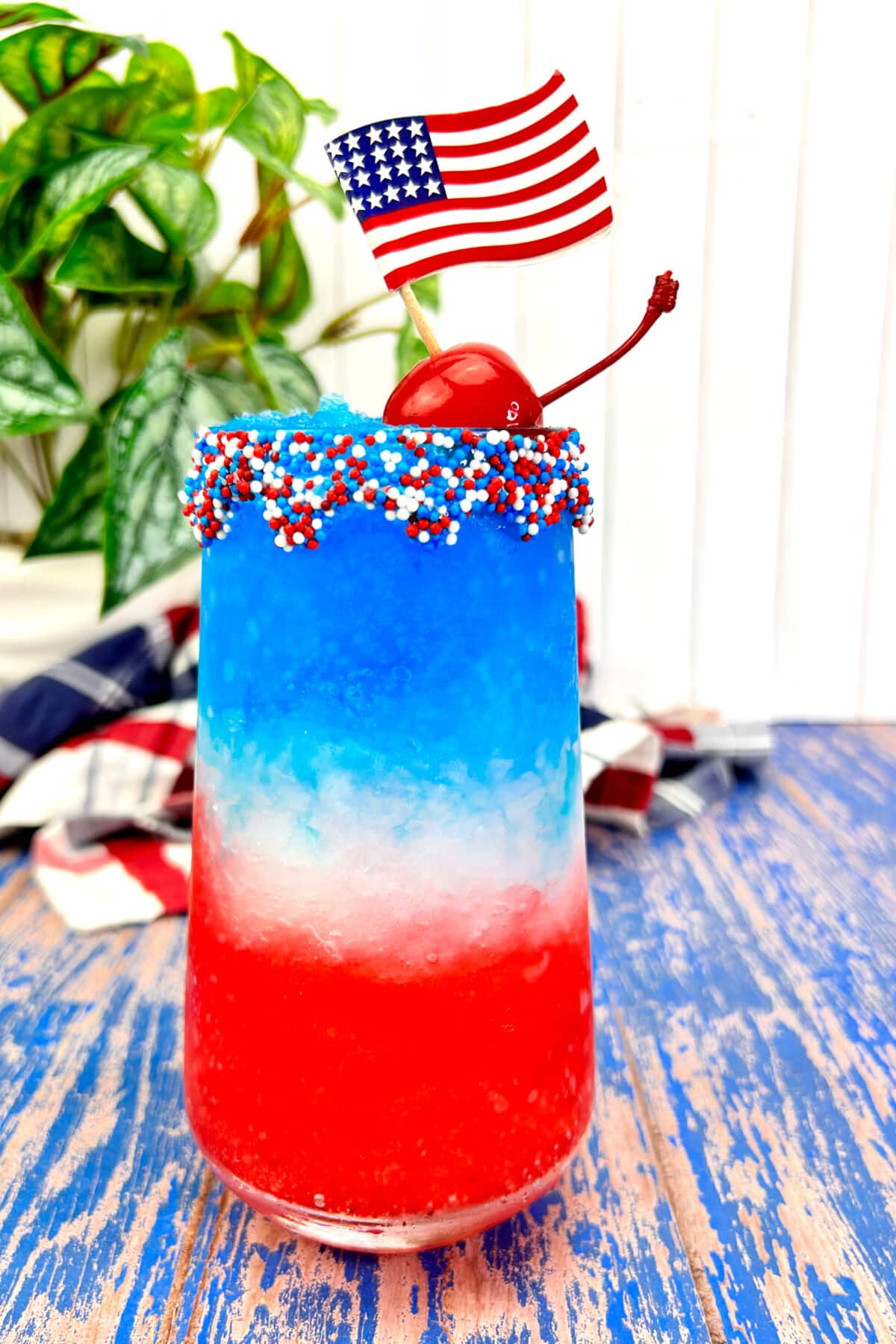 Red White and Blue Margaritas garnished with sprinkles and fresh fruit.
