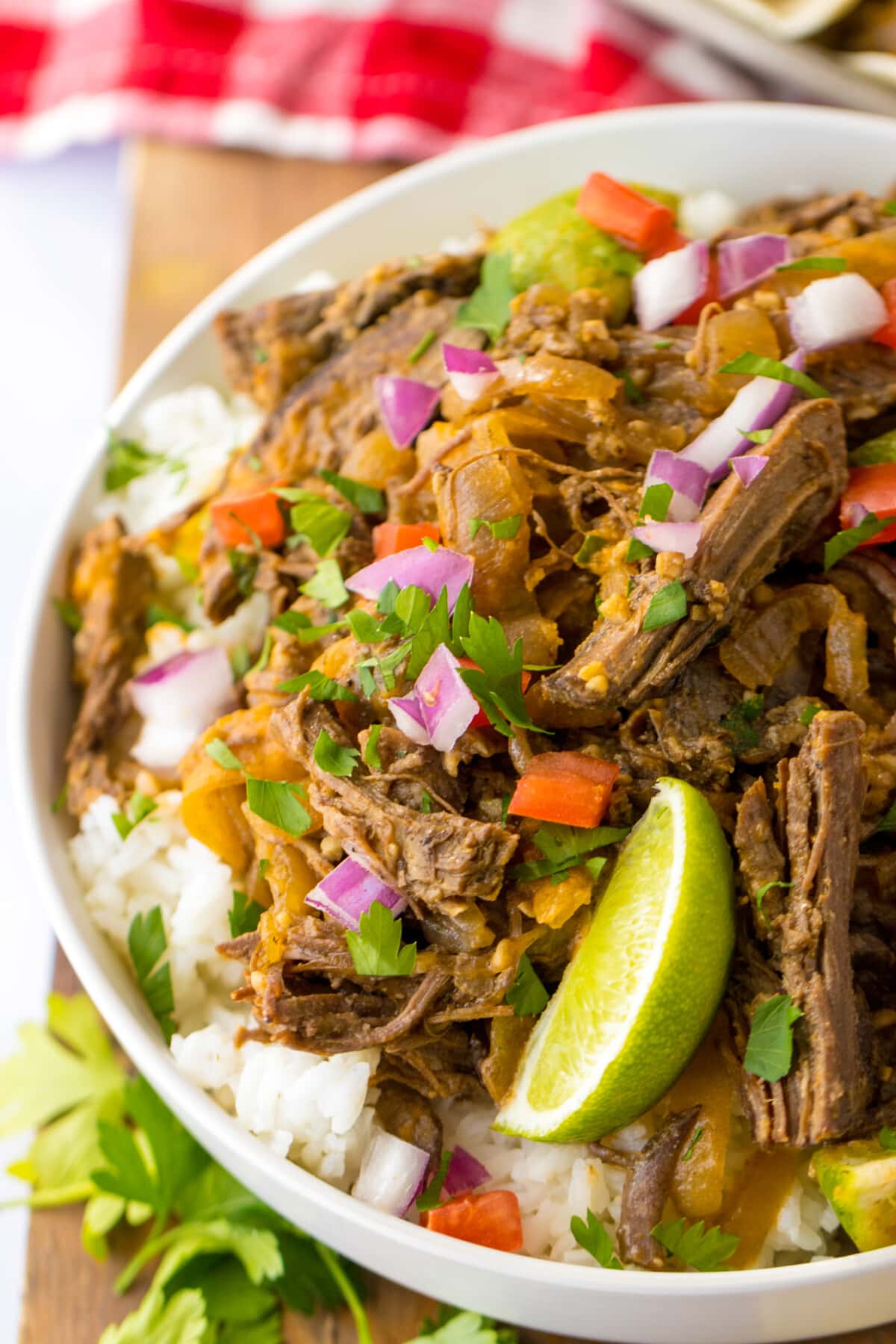 Slow Cooker Barbacoa on a bed of rice.