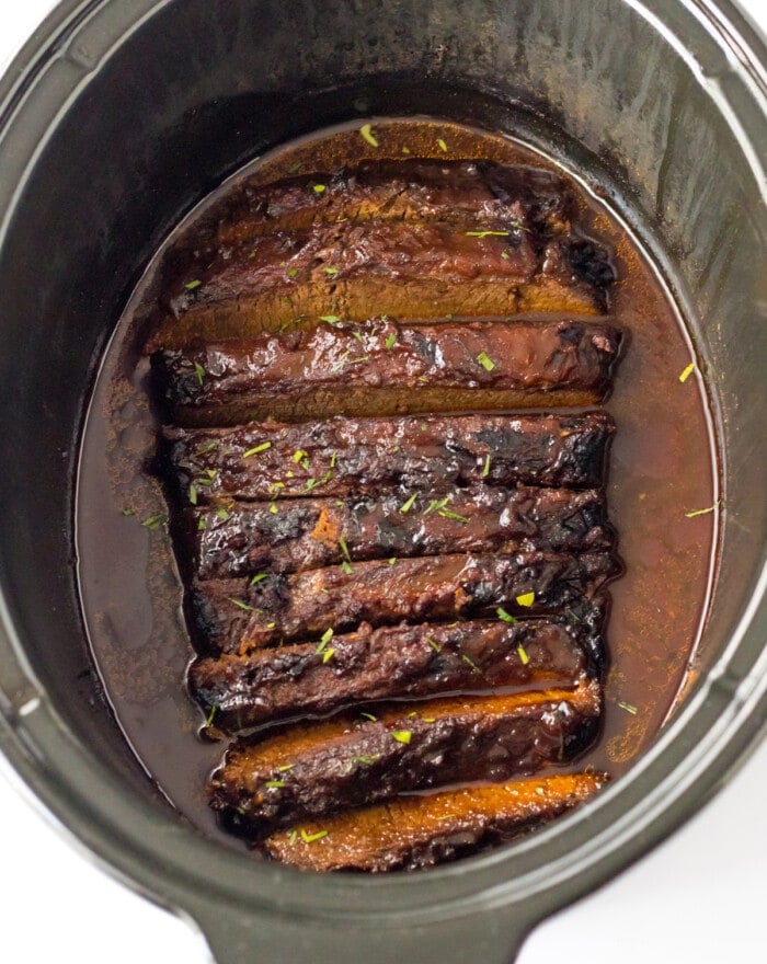 Cooked and sliced brisket in the slow cooker