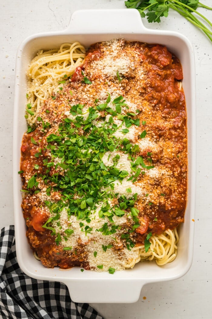 Baked spaghetti ingredients in a casserole dish