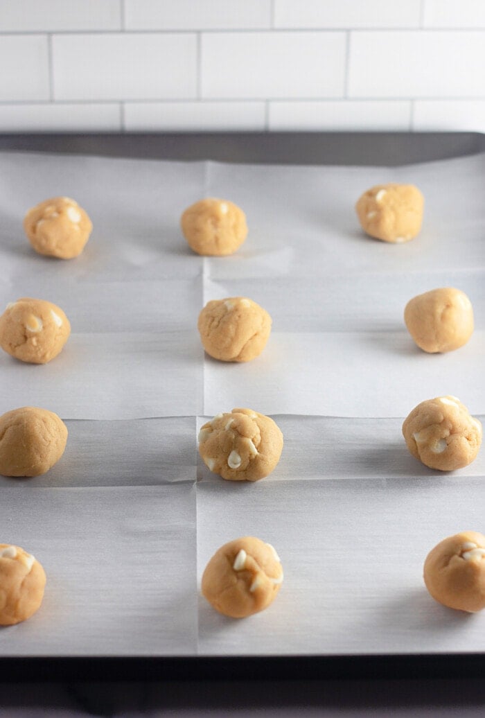 cookies ball on a baking sheet ready to be baked