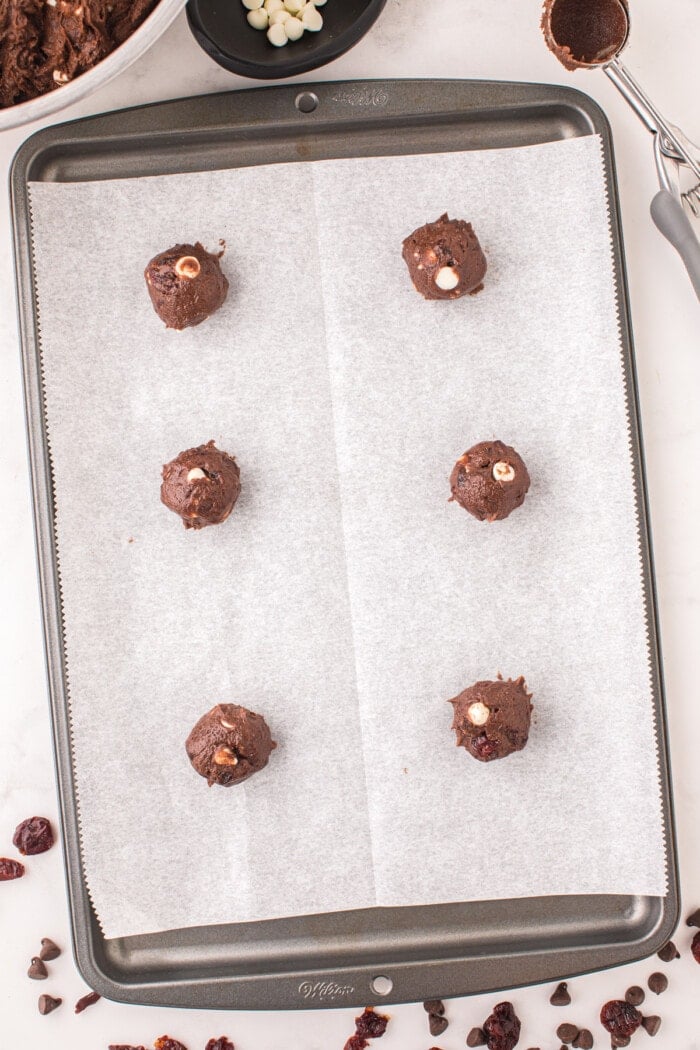 black forest cookies rolled in balls on baking sheet