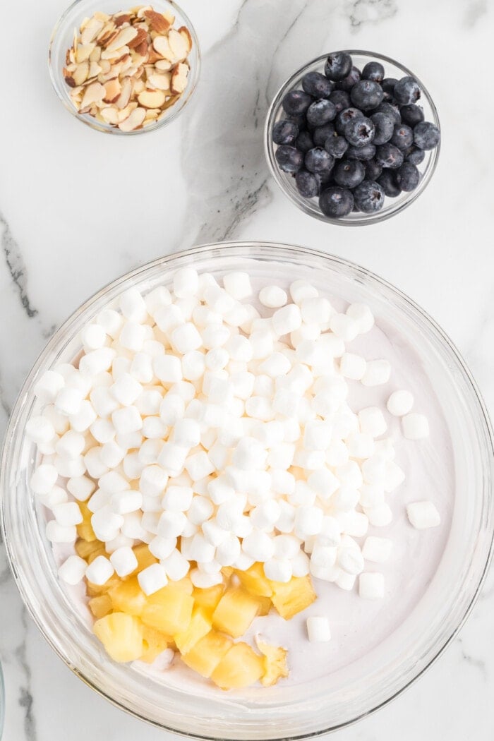 marshmallows and pineapple in bowl with blueberry fluff
