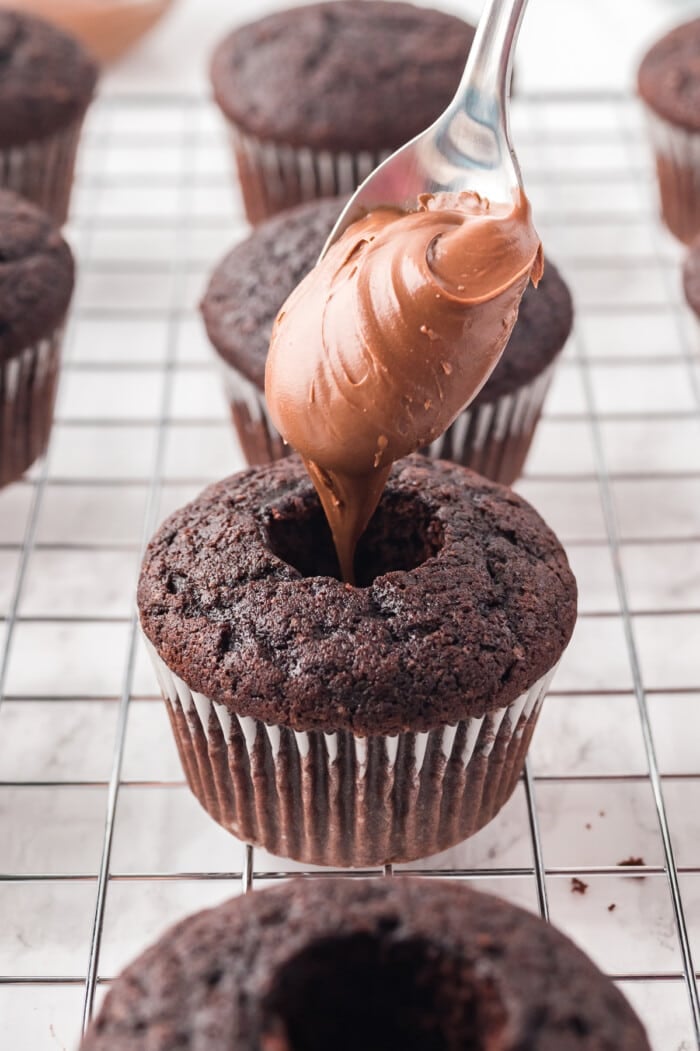 nutella spooned into chocolate cupcakes