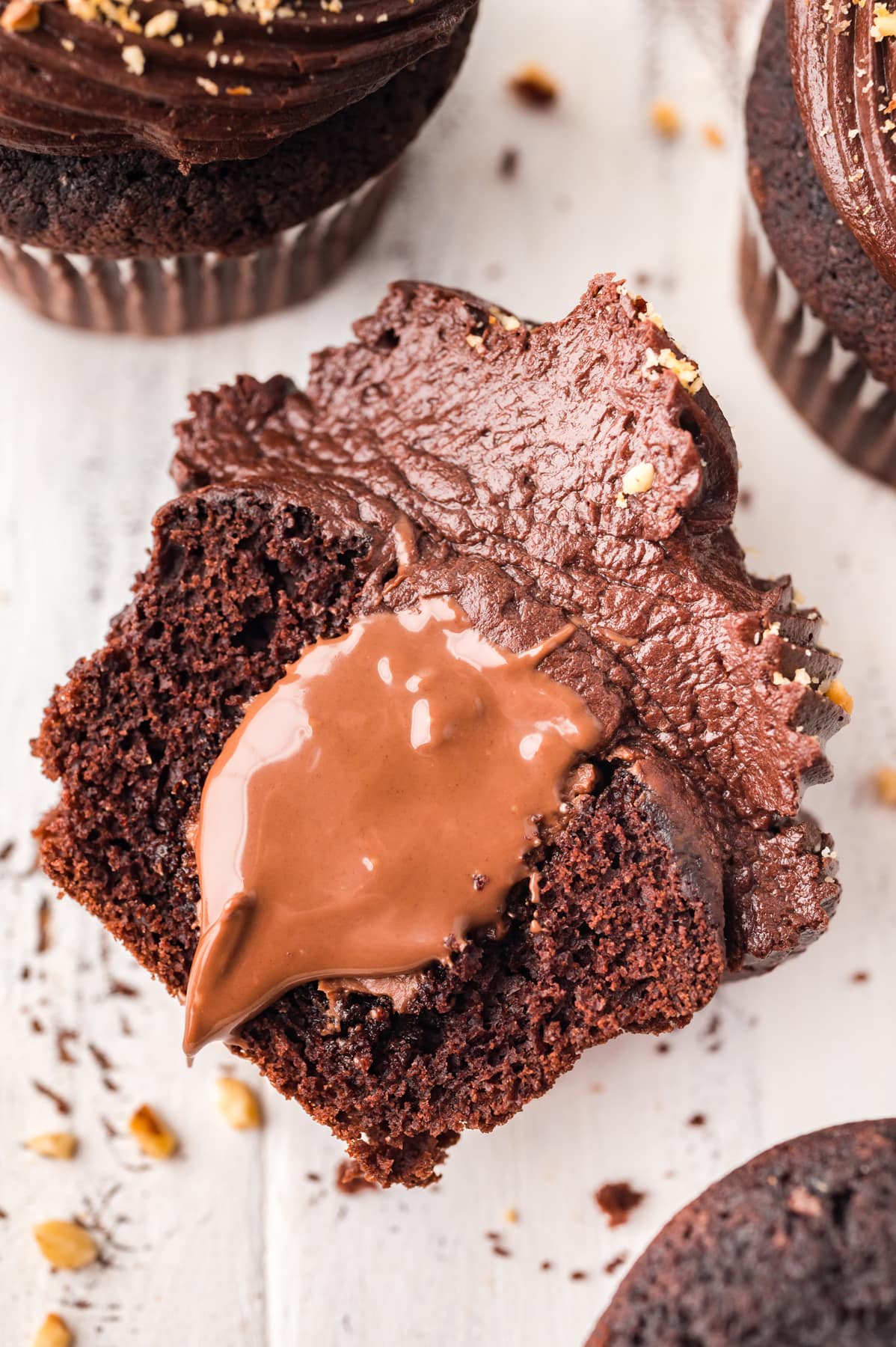 chocolate cupcake cut in half with nutella in center