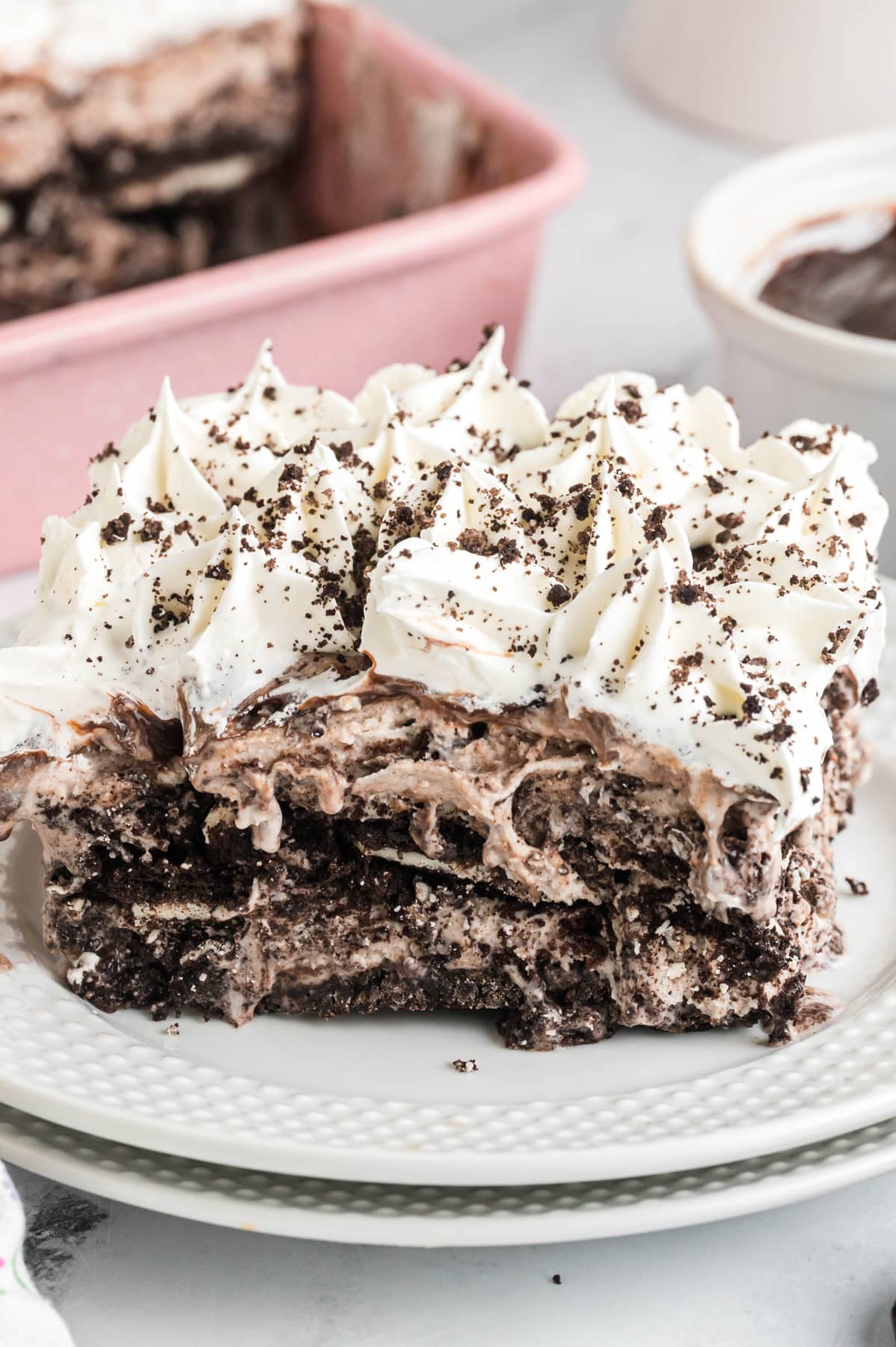 A slice of cookies and cream ice cream cake on a plate