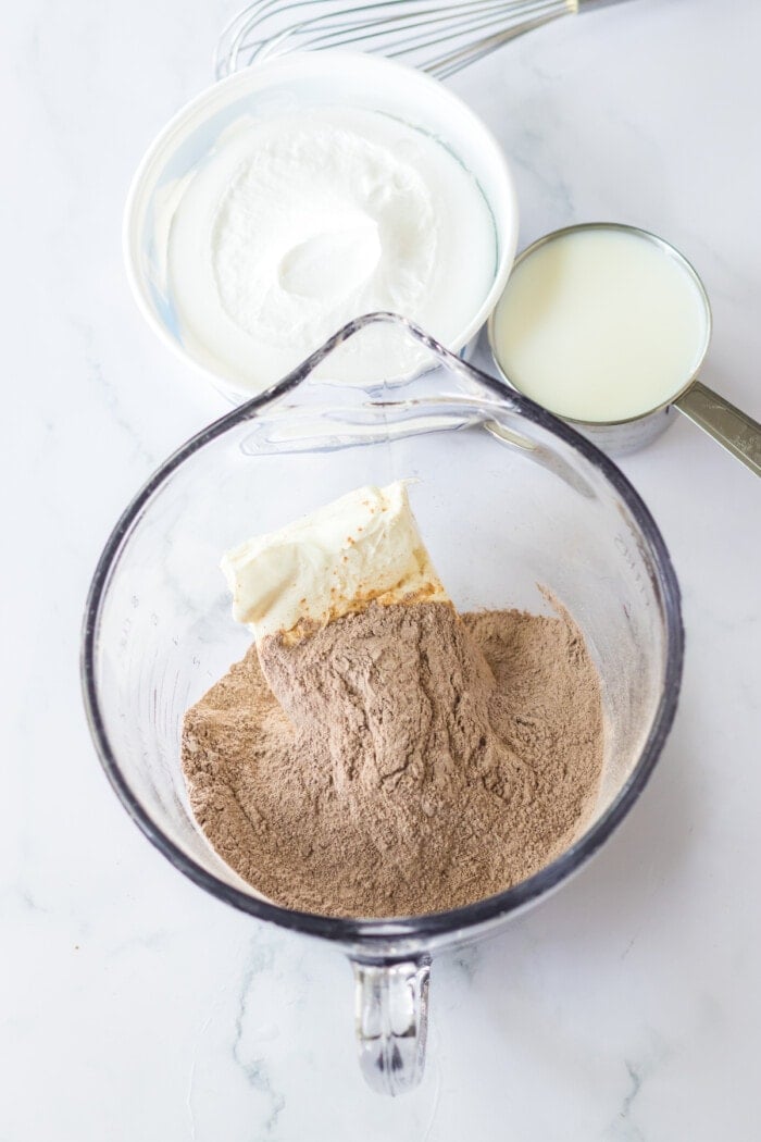 cream cheese and pudding mix in glass measuring cup