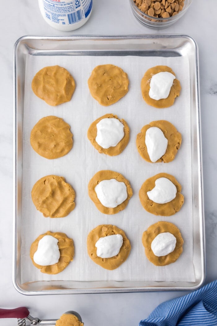 peanut butter cookies on pan with marshmallow fluff