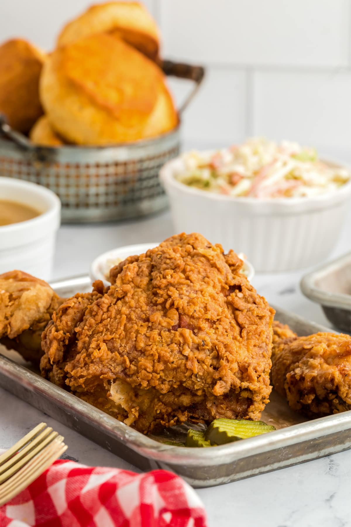best fried chicken on platter with pickles