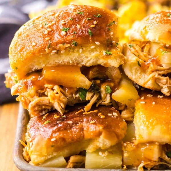 hawaiian chicken sliders stacked in metal tray
