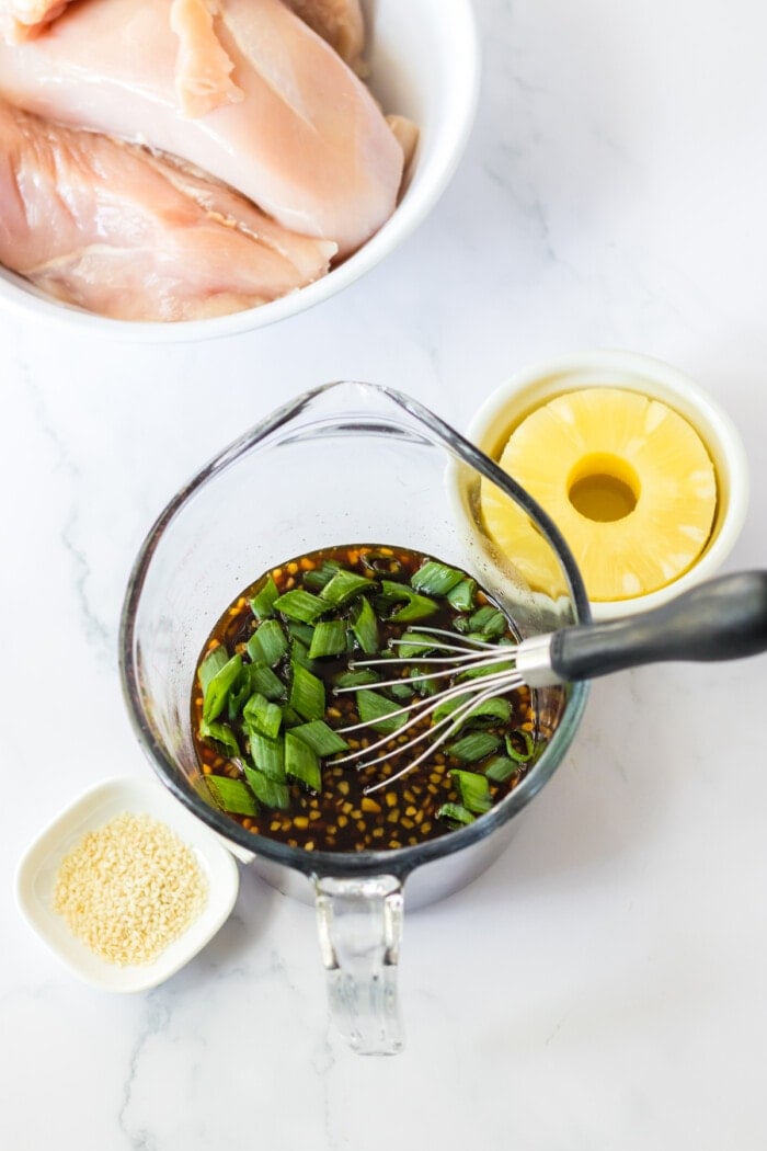 sauce in glass measuring cup