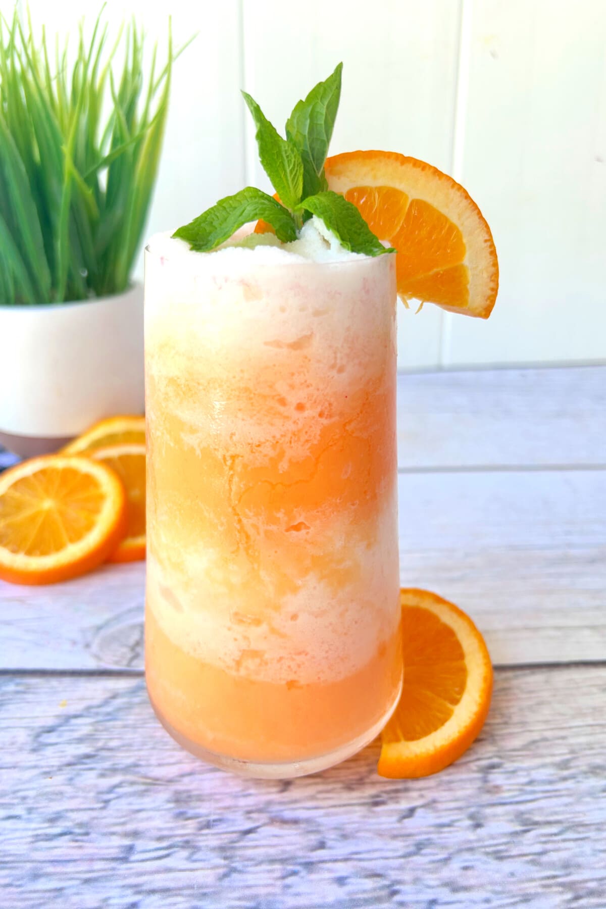 Orange Julius Cocktail garnished with mint.