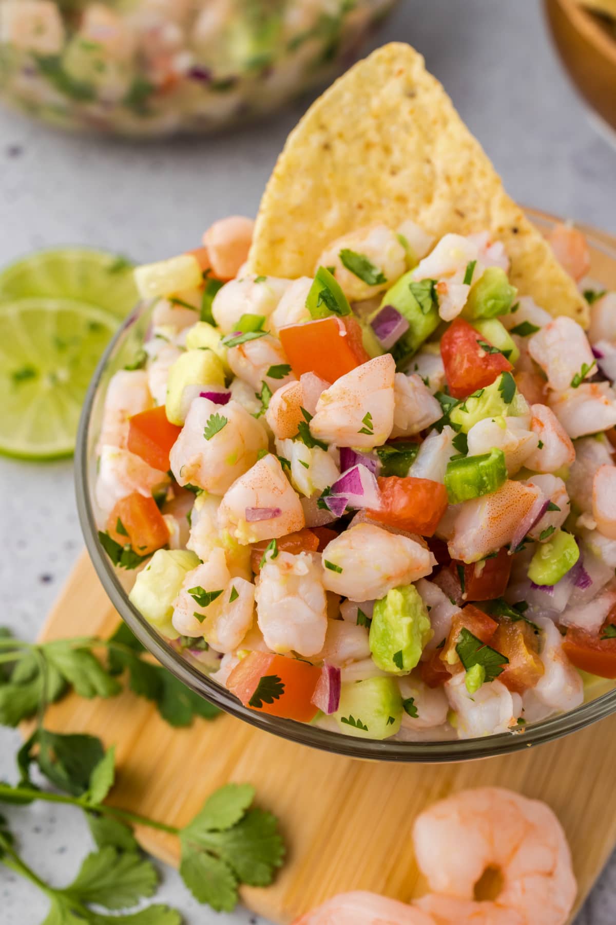 shrimp ceviche in small glass bowl with tortilla chip