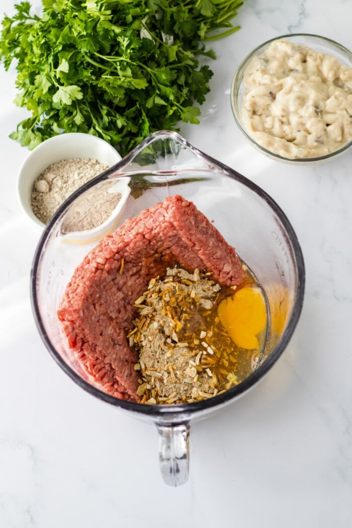 ground beef, onion soup mix and egg in mixing bowl