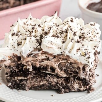 A slice of cookies and cream ice cream cake on a plate