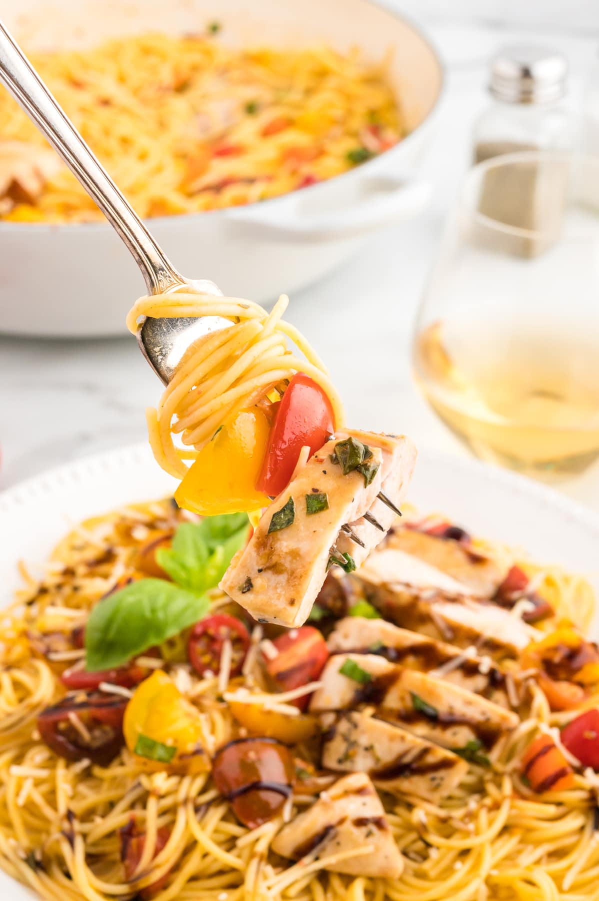 bruschetta chicken pasta on fork