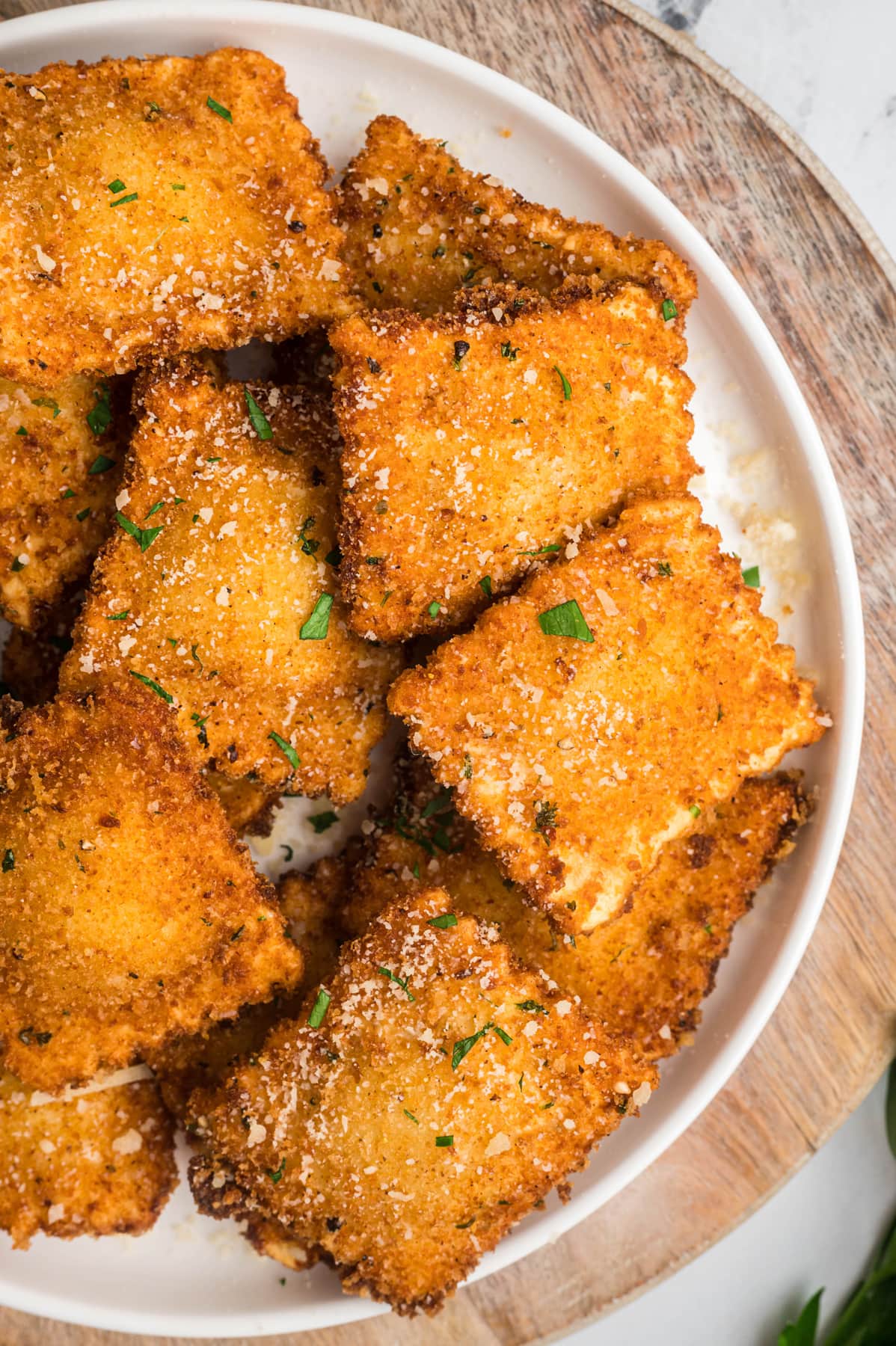 Overhead view of a plate of toasted ravioli
