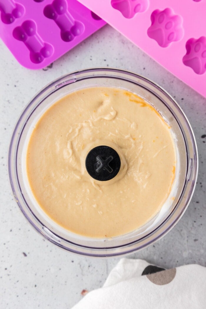 Blended bananas, yogurt, and peanut butter in a food processor