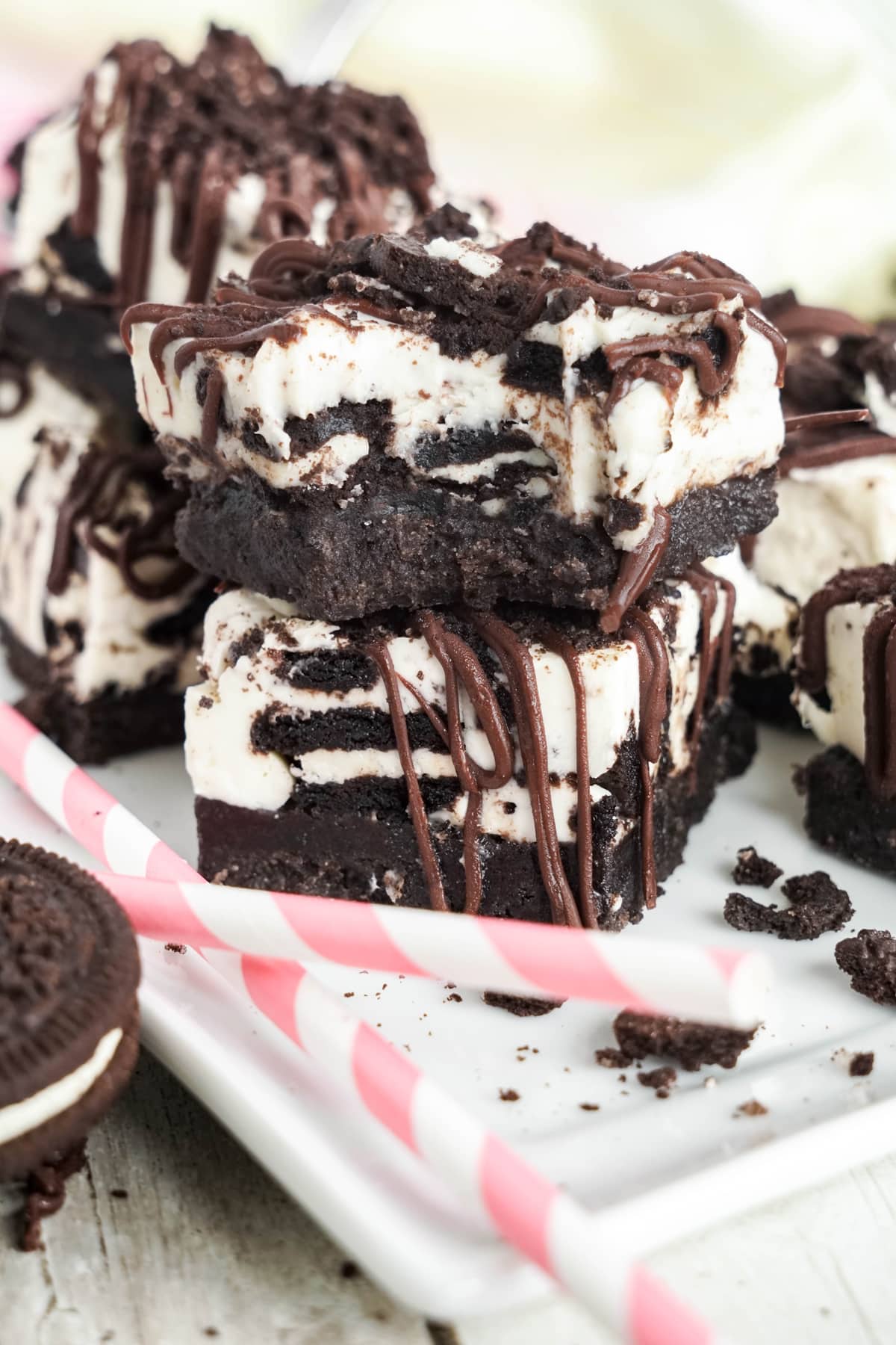stacks of oreo cheesecake bars with bite out